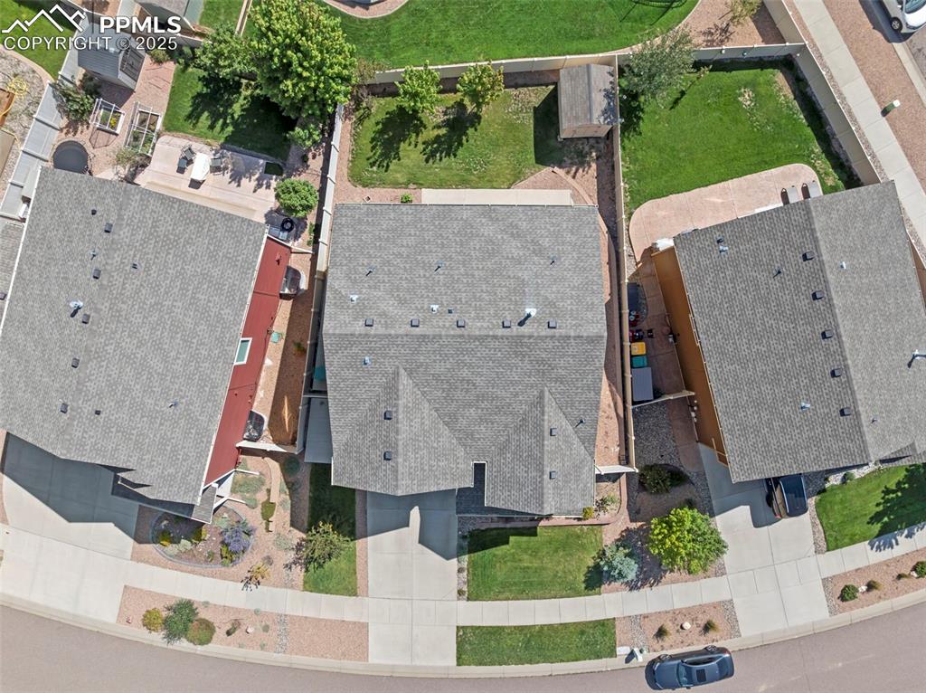 Fully fenced backyard with large storage shed