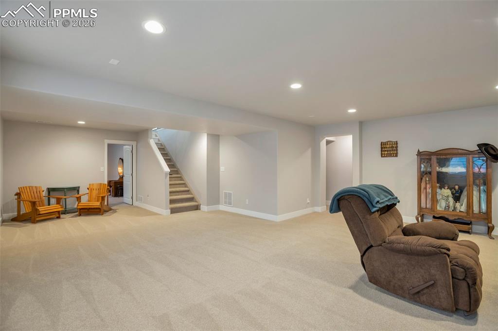 Basement featuring recessed lighting and light carpet. The far left is where the wet bar could be located.
