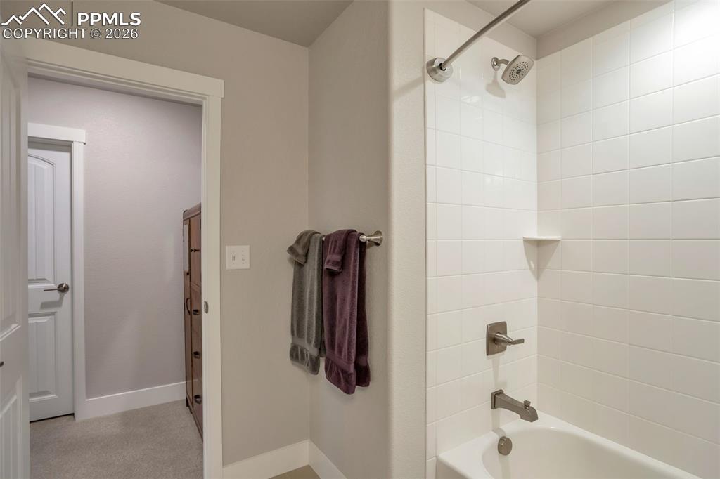 Primary Full Bathroom #3 in Basement for Primary Bedroom #2 featuring shower / washtub combination