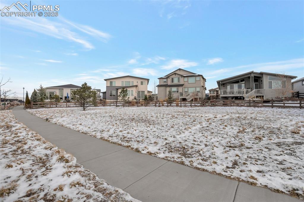 Left house, showing the green space and the fully fenced back yard.