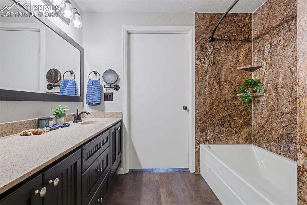 Full bath that shows entry door into bdrm 3