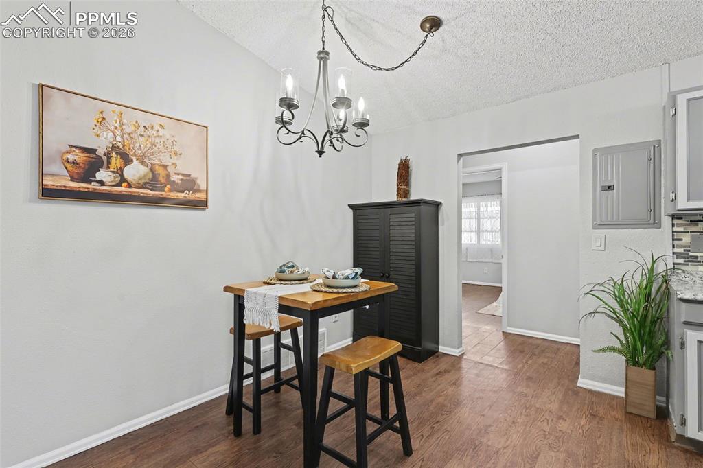 Dining area with view of Primary bdrm in the middle