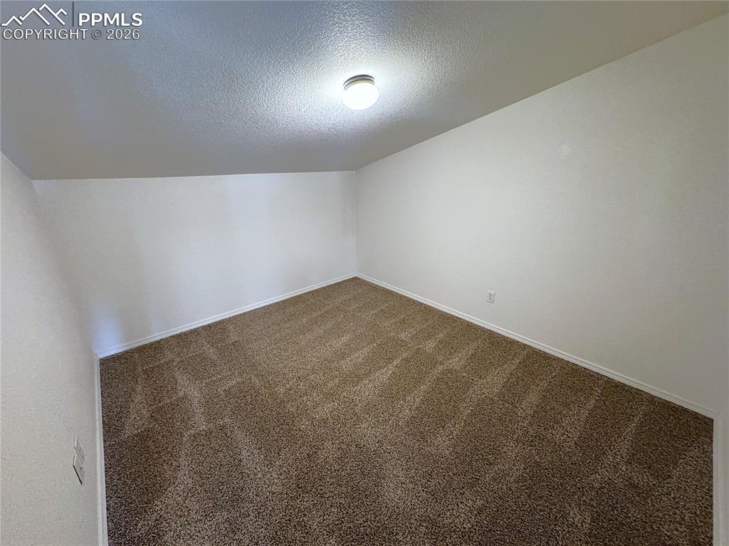 Upstairs Bonus Room is perfect for a Den/Study or additional storage