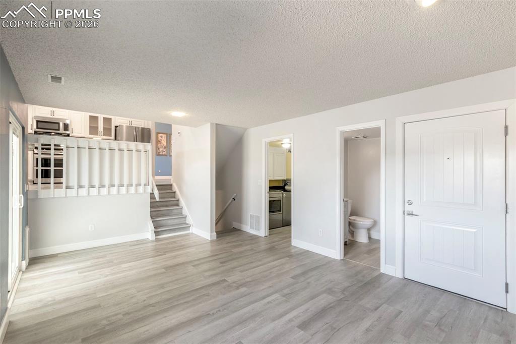 Additional view of walk-out Family Room looking toward main level kitchen