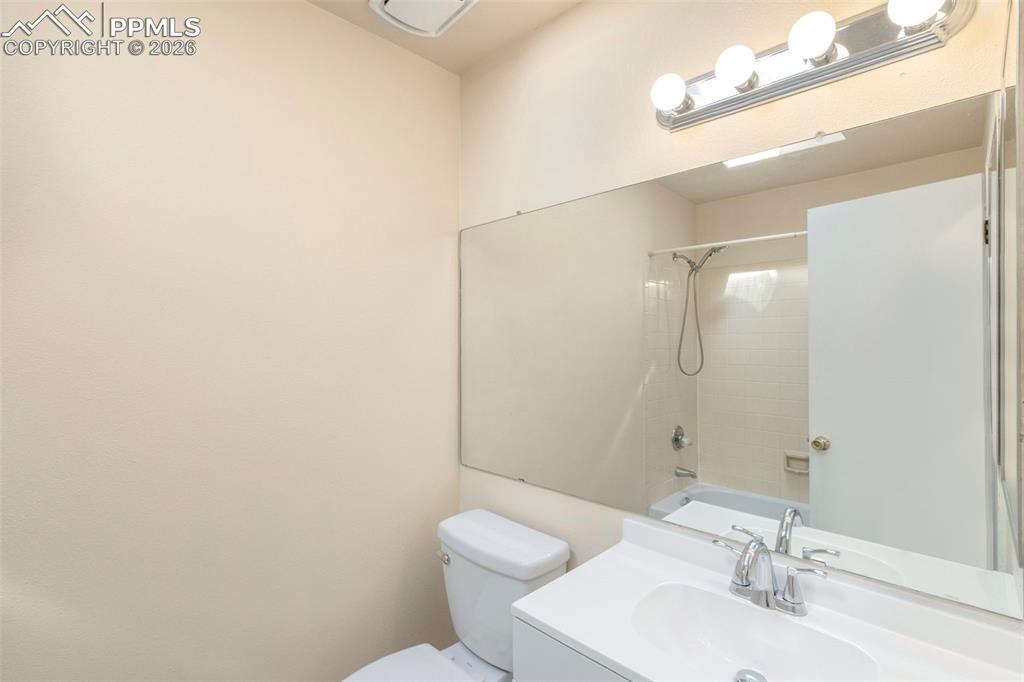 Upper level hall Bathroom with updated vanity, medicine cabinet, tub/shower combination, and skylight.