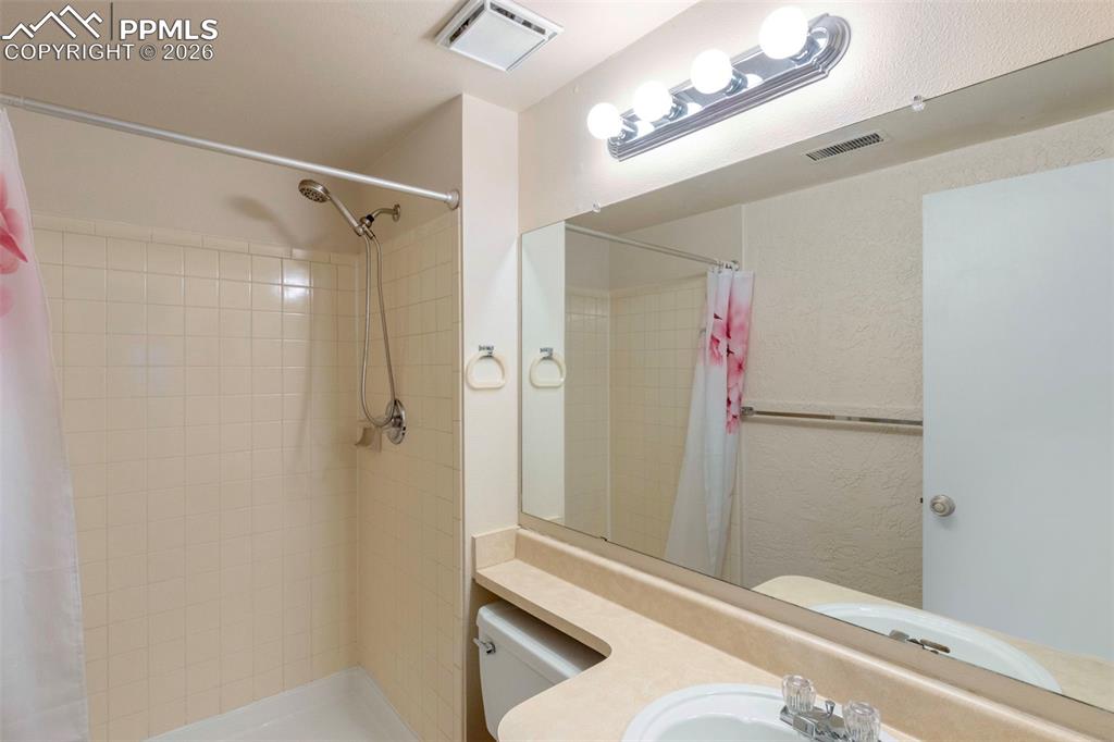 Basement 3/4 Bathroom features a vanity and shower stall