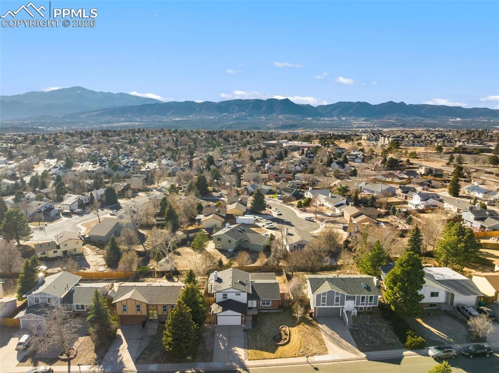 Aerial perspective of suburban area with a mountain backdrop