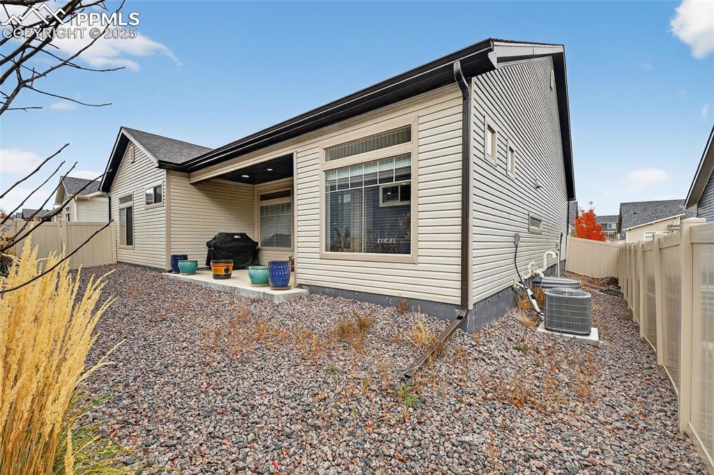 Back of house featuring a fenced backyard and a patio area