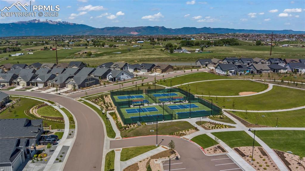 Aerial perspective of suburban area with a mountain backdrop