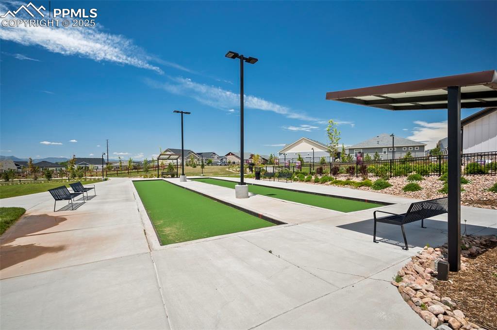 Surrounding community featuring a game area and a residential view