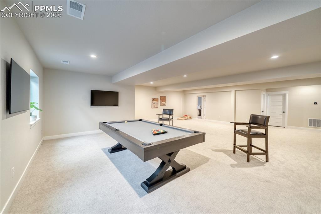 Recreation room with billiards, light carpet, and recessed lighting