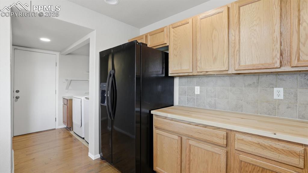 The Laundry Room is located off the Kitchen.