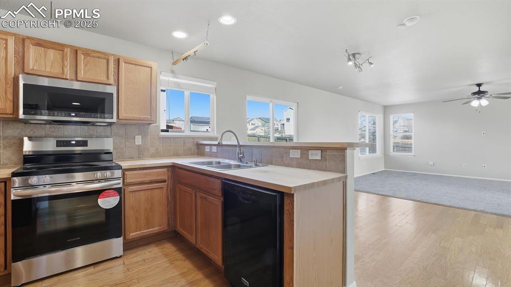 Kitchen, Dining Area, and Living Room.