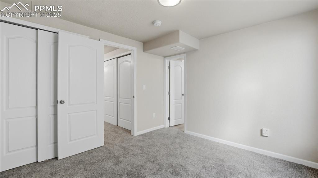Basement Bedroom #5 provides private space for family or visiting guests.