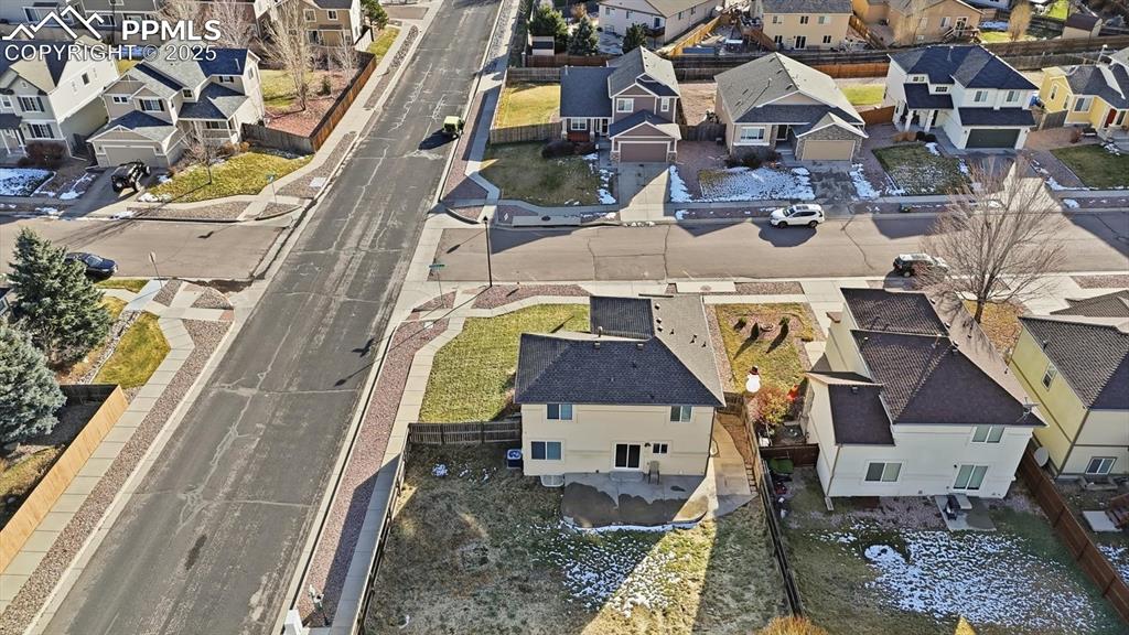 Aerial view of home and corner lot.