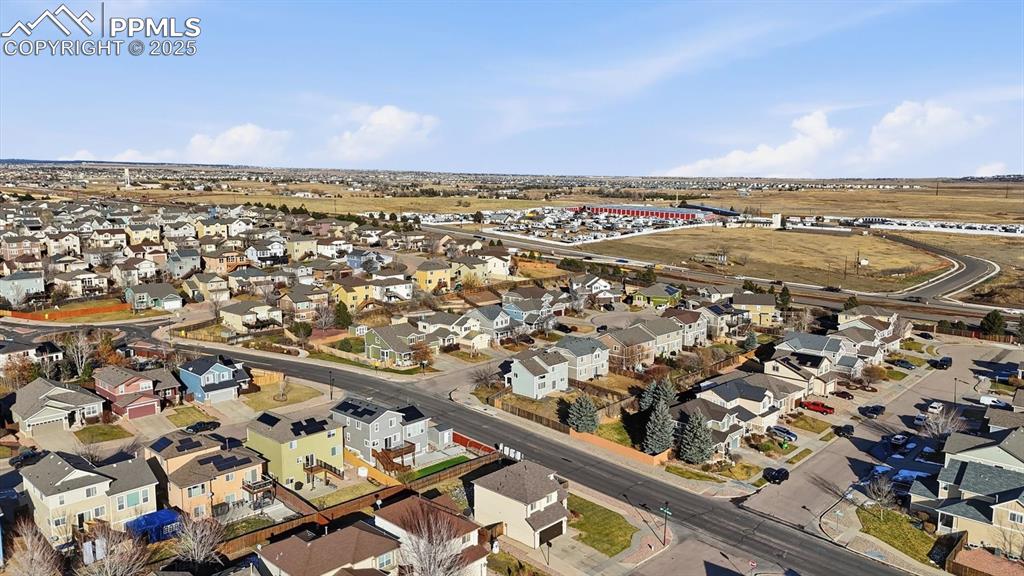 Aerial view of home and neighborhood.