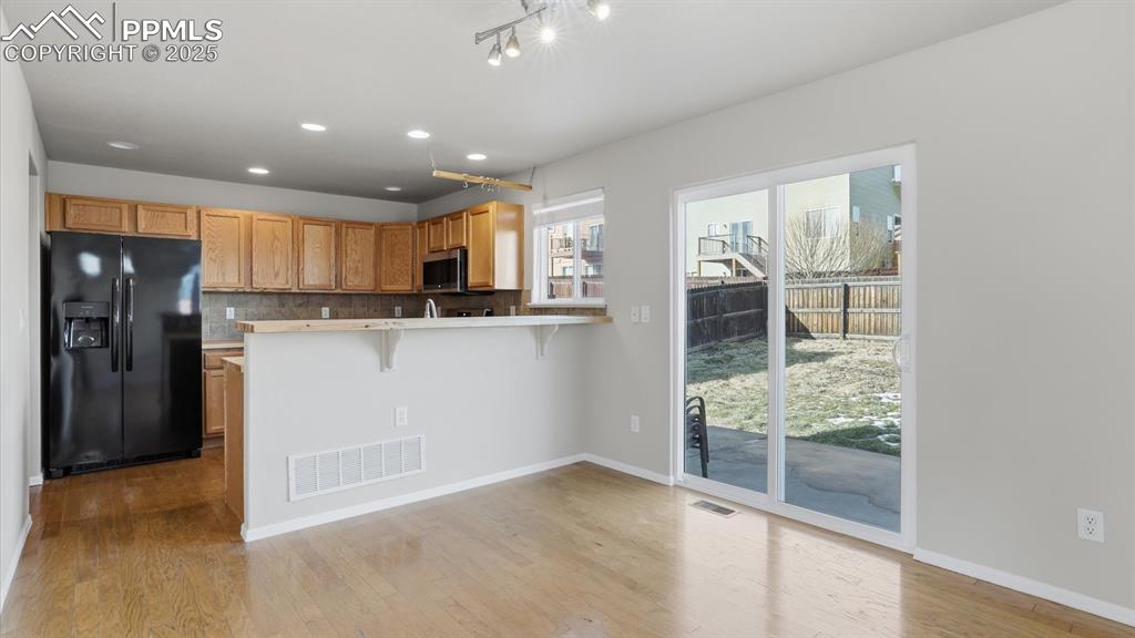 Kitchen/Dining Area with slider to the backyard patio.