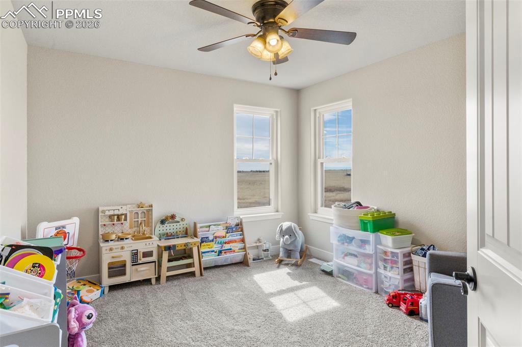 Upstairs Bedroom #2 with unique corner window offering excellent views