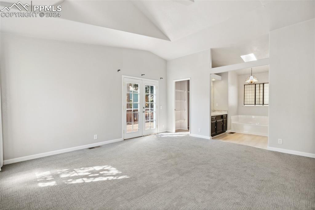 Primary suite with two walkin closets and attached bathroom