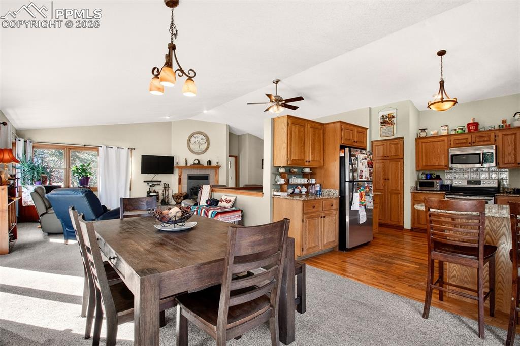 Additional view of the open concept main area highlighting the dining area
