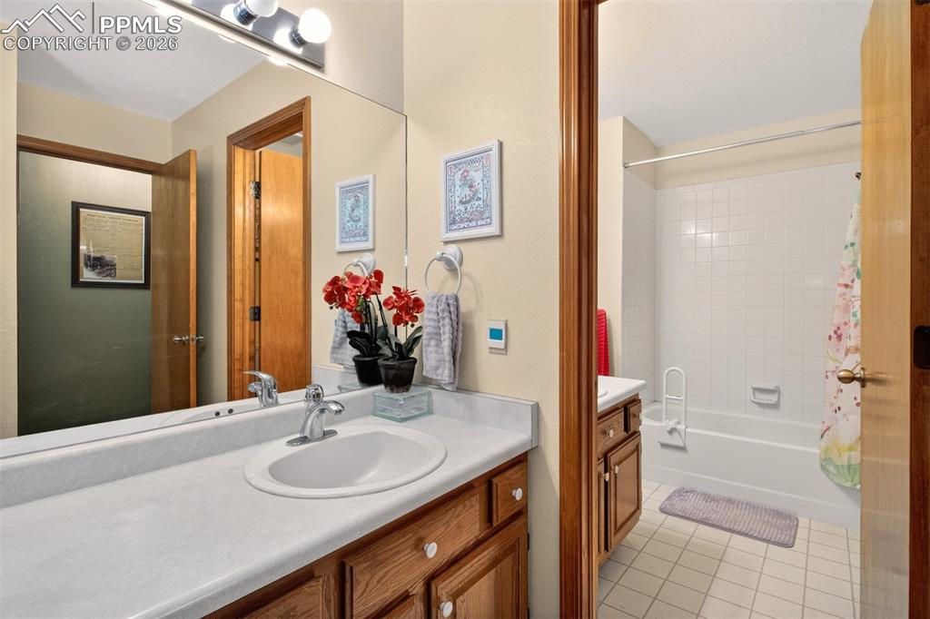 Full bathroom located near lower level bedrooms