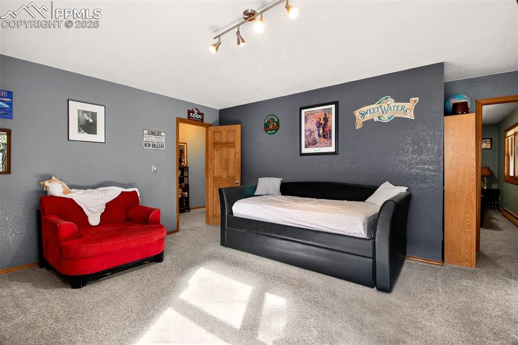 Family room with walk out to covered lower deck with hot tub and dog run