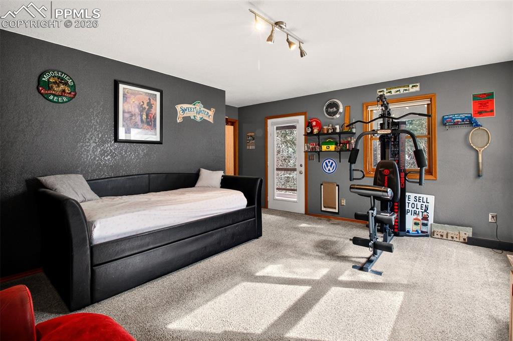 Family room with walk out to covered lower deck with hot tub and dog run