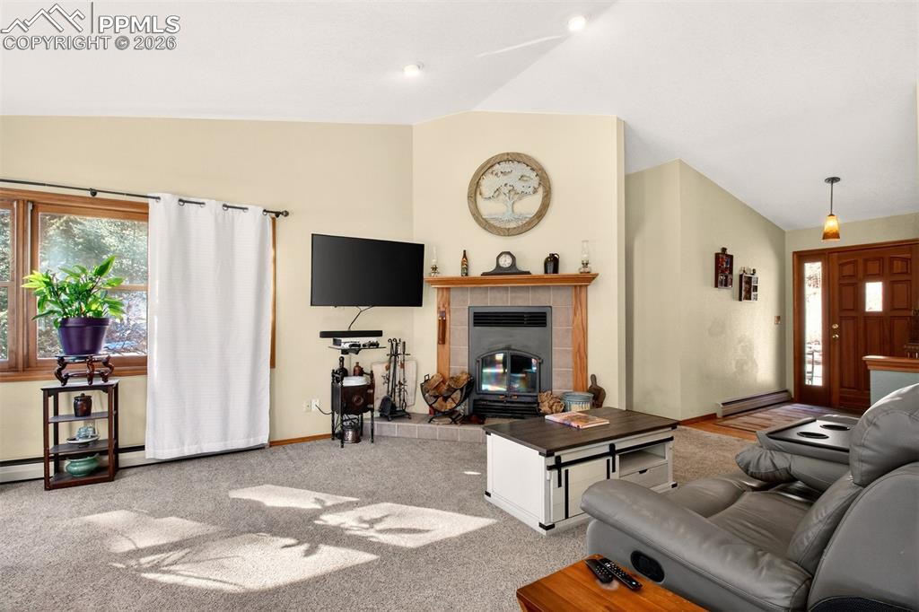 Living room highlighting the wood burning fireplace 