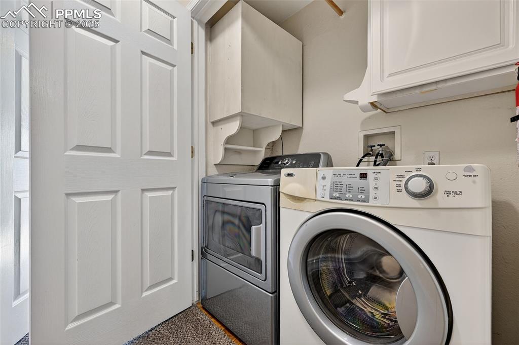 Laundry Conveniently Located in Hallway Between Both Bedrooms