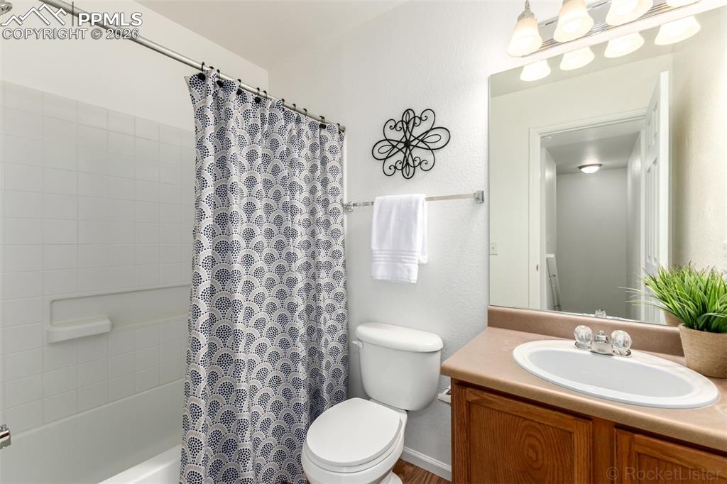 Bathroom with vanity and shower / bath combo