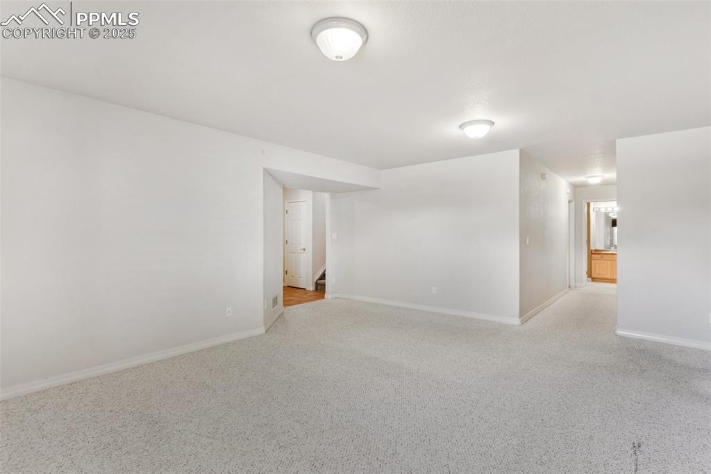 Large family room in lower level, hallway to two nice sized bedrooms and full bath