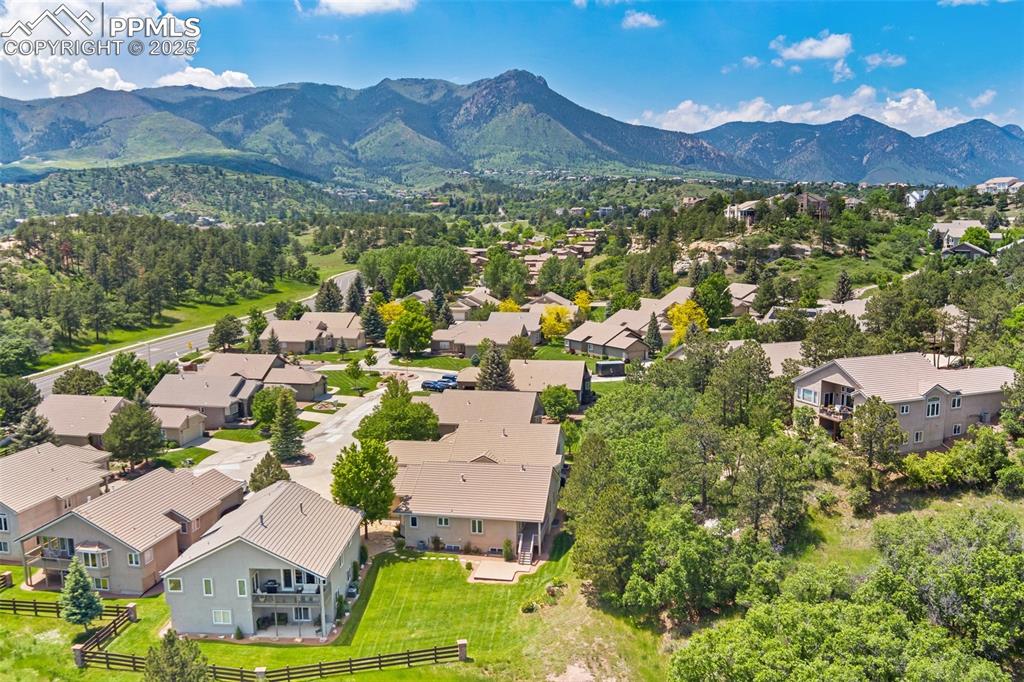 Aerial perspective of suburban area featuring a mountain backdrop