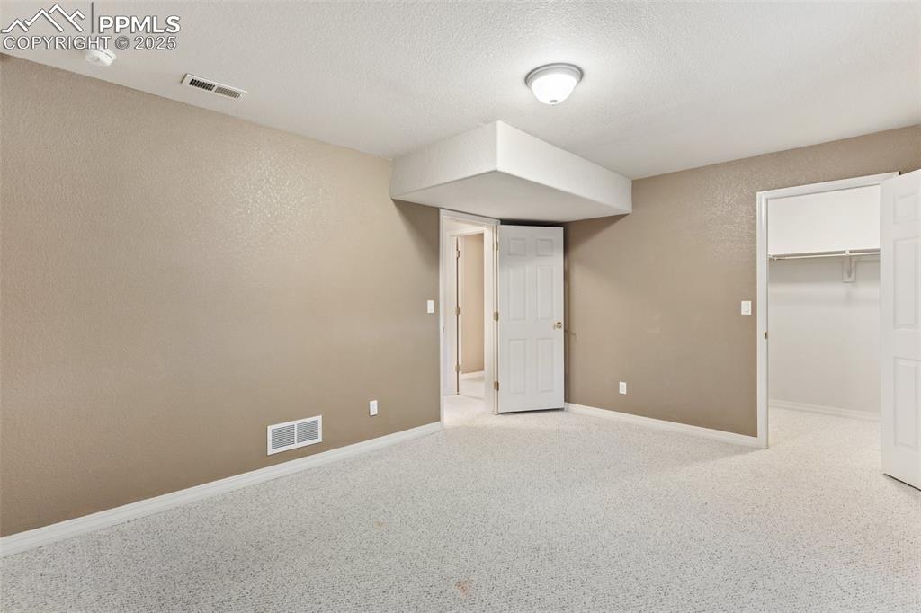 Large bedroom in lower level with spacious walk in closets