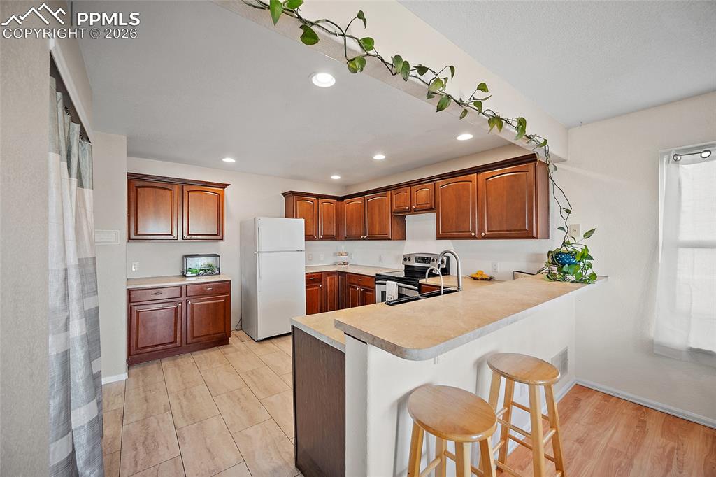 Kitchen featuring a breakfast bar