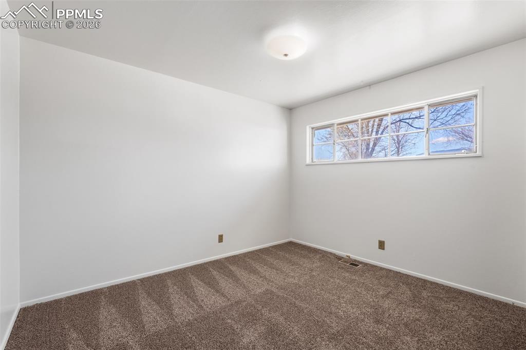 Bedroom 1 featuring new carpet