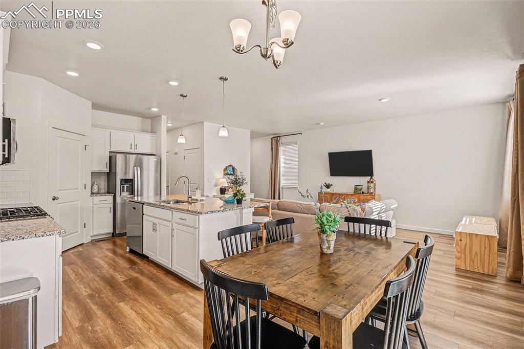 Convenient dining area with walkout to patio and back yard.