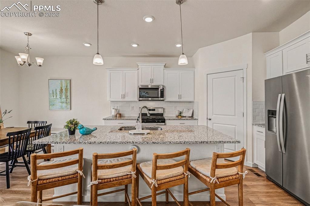 Gorgeous modern kitchen with granite counters and stainless steel appliances!