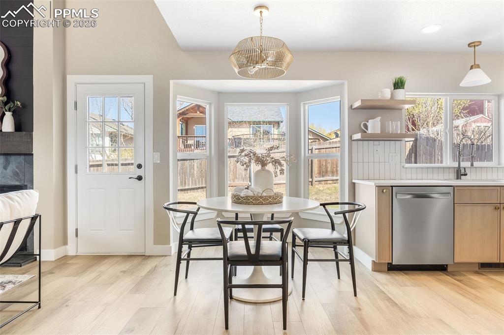 Dining space featuring light wood finished floors and baseboards