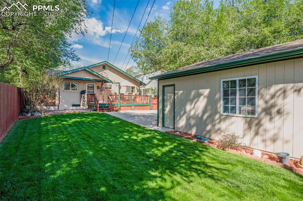 View of yard featuring a deck
