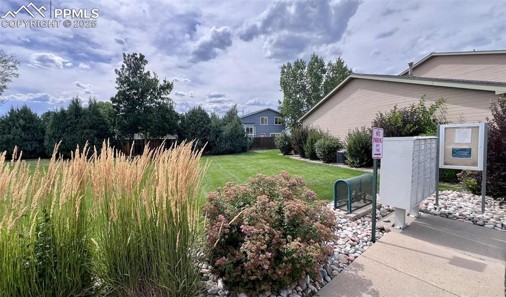 View of yard with mail area