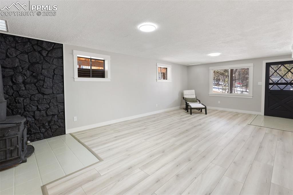 family area with wood-burning stove, and walk-out to the yard