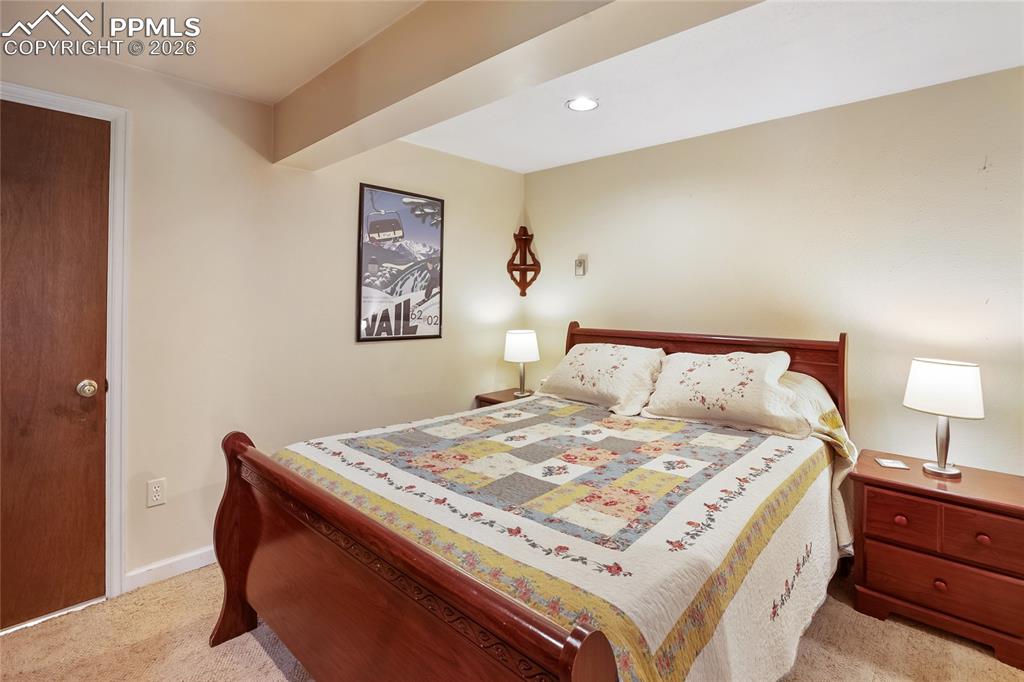 Bedroom with carpet and recessed can lighting
