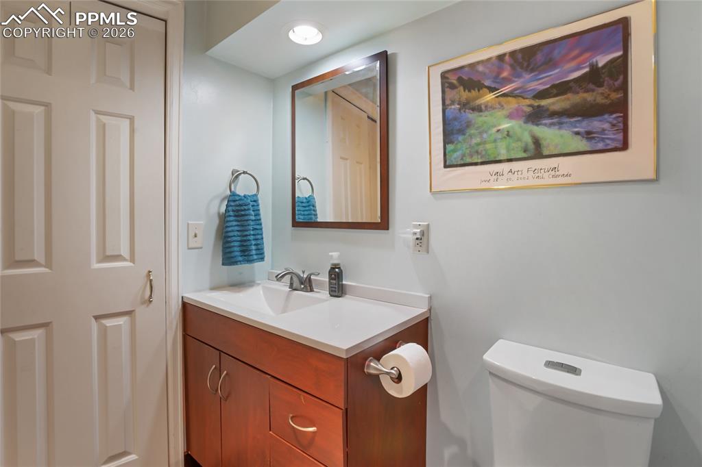 3/4 bathroom featuring vanity and toilet!