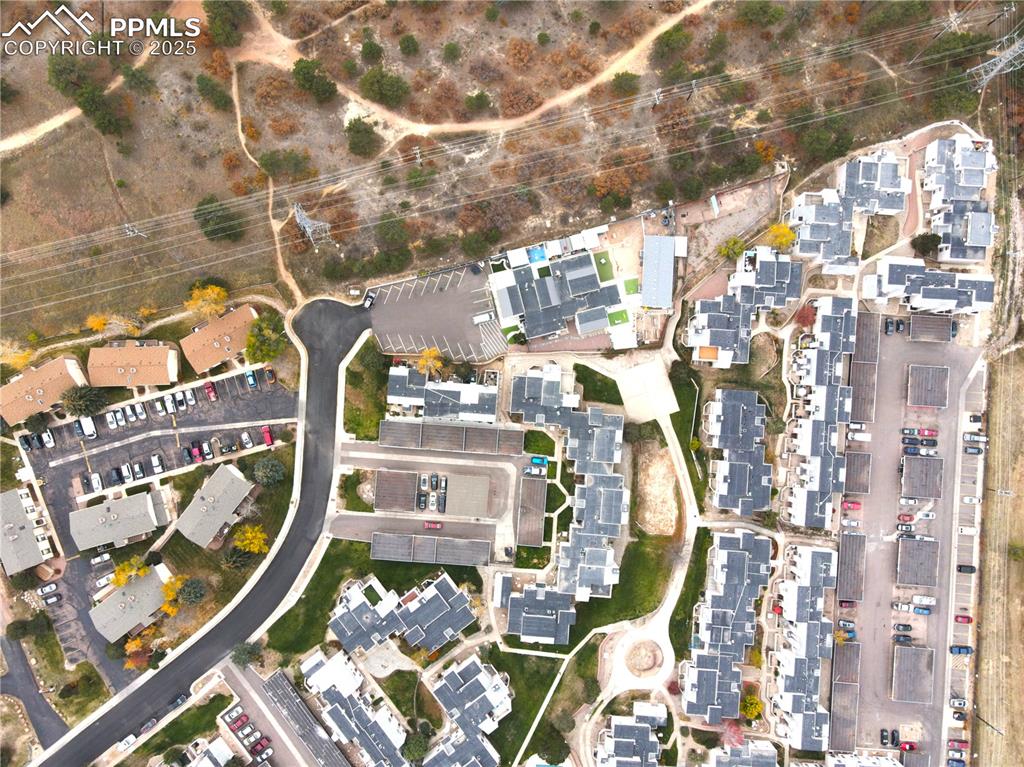 Aerial view of property's location with nearby suburban area