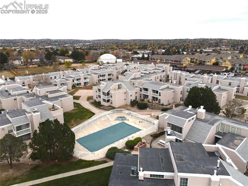 Aerial perspective of suburban area featuring a pool area