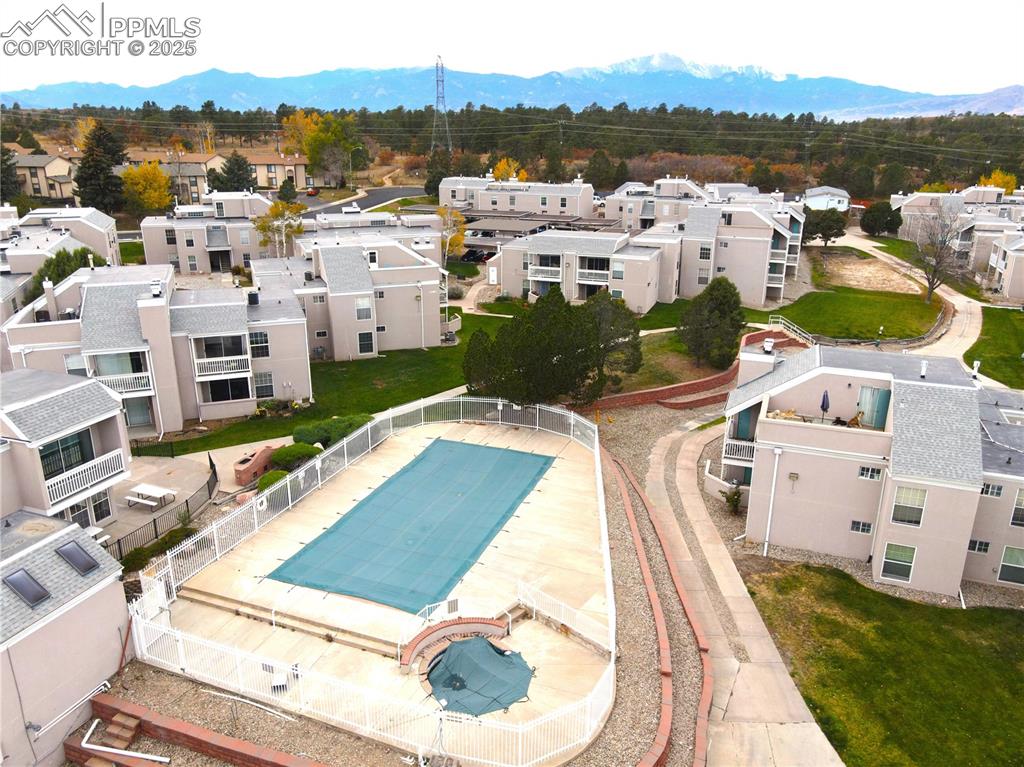 Aerial perspective of suburban area featuring a mountainous background