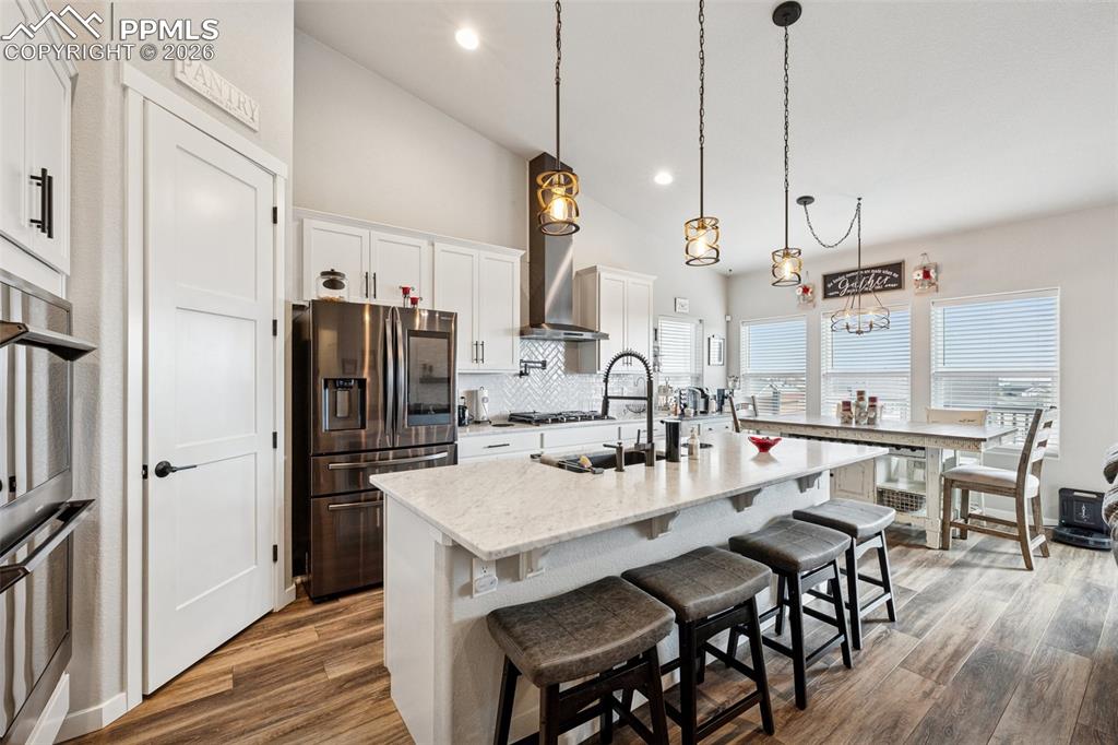 Great countertop space, plenty of seating at the island bar and room for a large dining room table too!