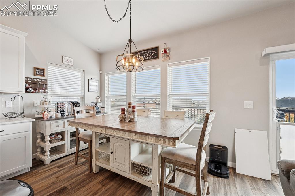 Dining area with attention to detail in the lighting and great views of the back yard.