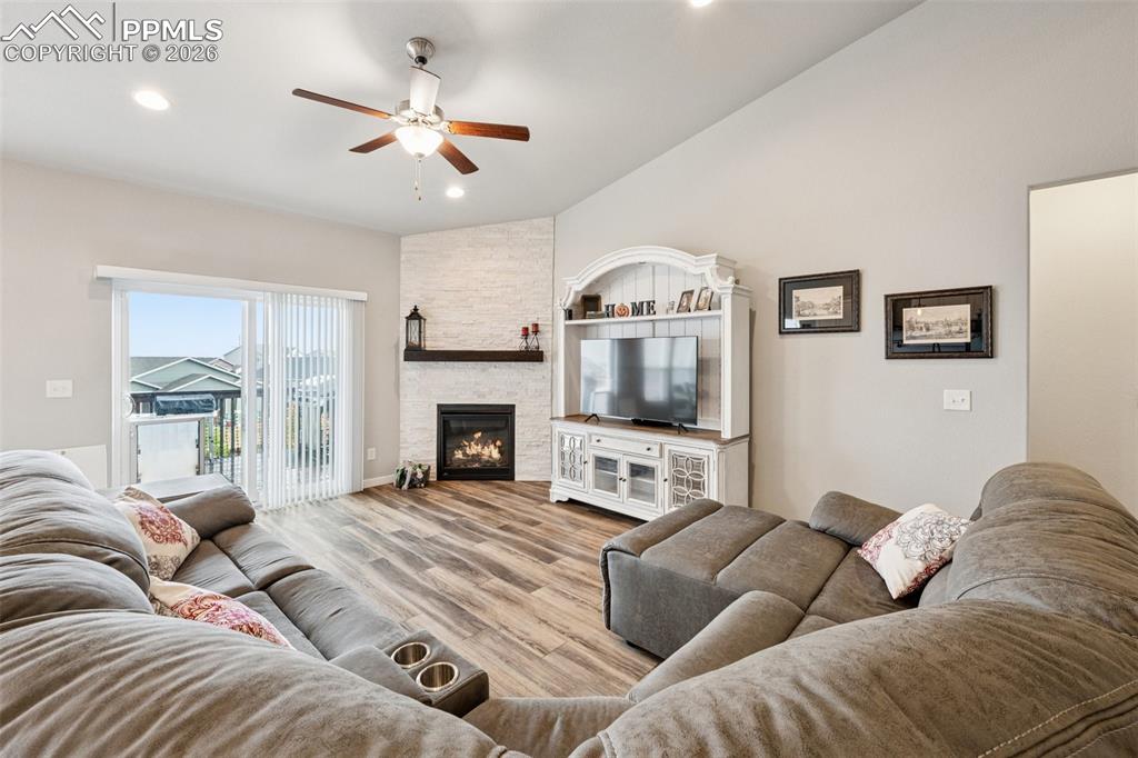 Living room is cozy.  Homeowners loves the easy care flooring throughout the main level and convenient location of the primary suite bedroom just off the main spaces.