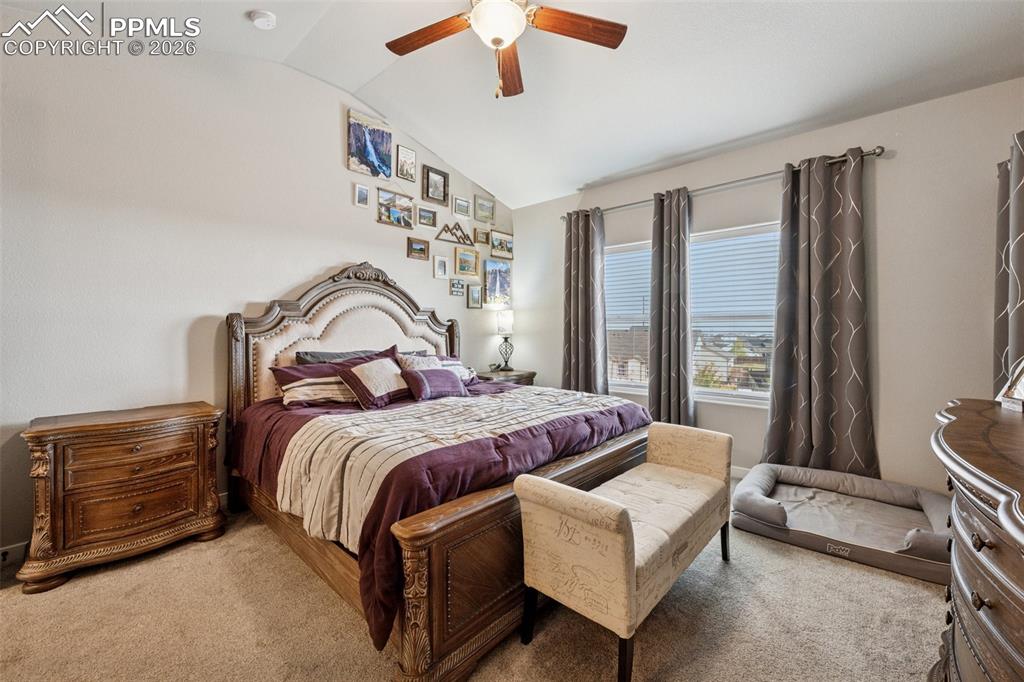 Large primary suite with ceiling fan and great views.  Main floor location.